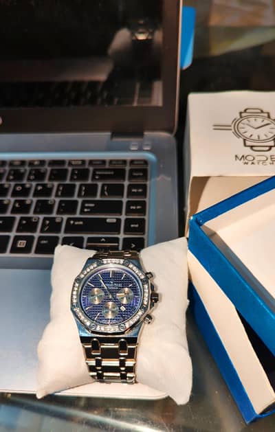 Aude Mars Royal Oak with navy blue dial and diamond bazel-set