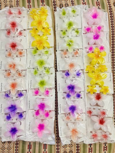 Pack of 12 one large flower clip & two small flowers clips Each pack2k