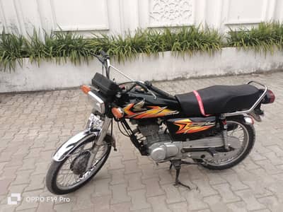 Honda 125 Al Panjab number.