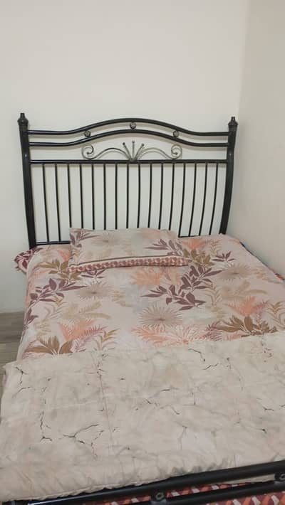 Iron bed, larger than single bed