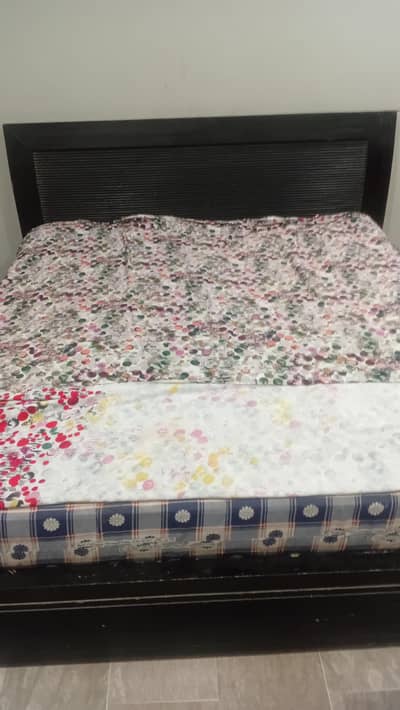Old style king size bed with spring mattress