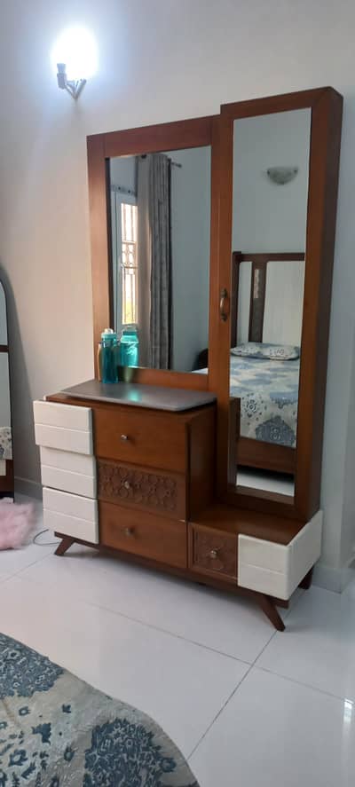 bed with side tables and dresser