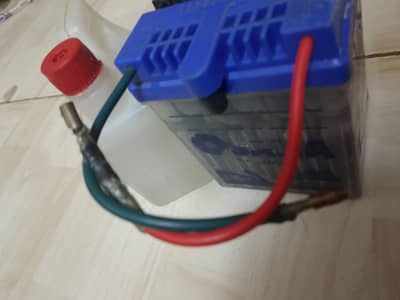 bike battery 12volt with water and bottle
