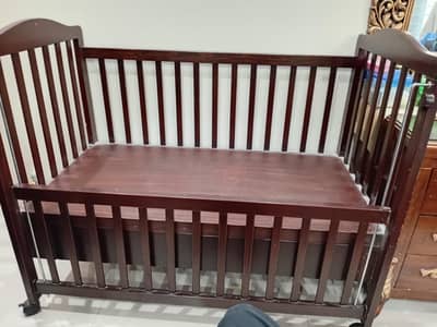 wooden baby cot. condition 9/10. . 4 wheels. . just buy n use