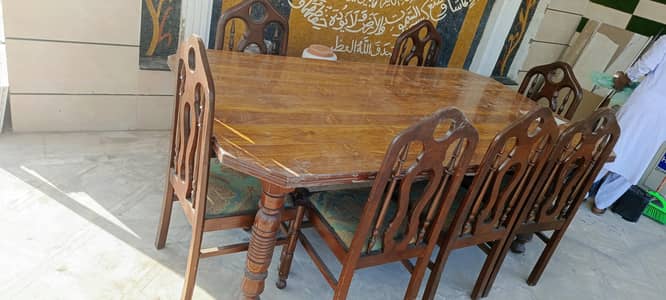 wooden dining table with 8 chairs