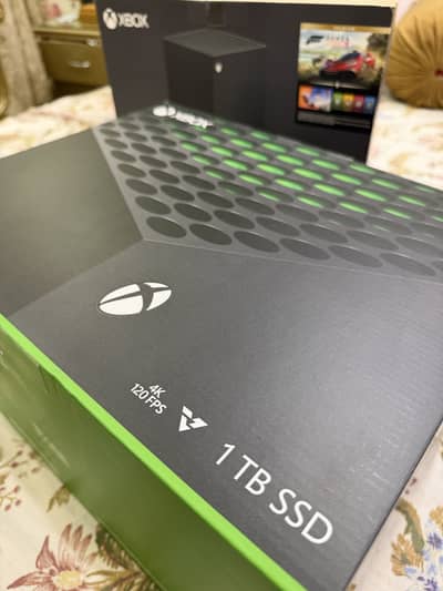 Xbox series x box open with controller