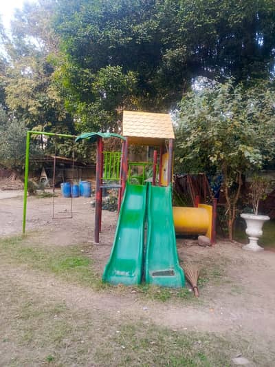 Kids swings and slides and full playground