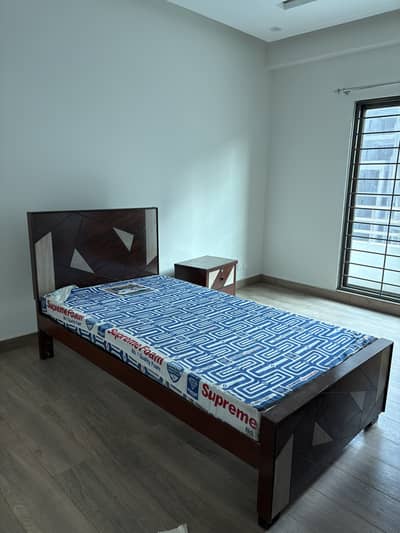 Used single bed with side table