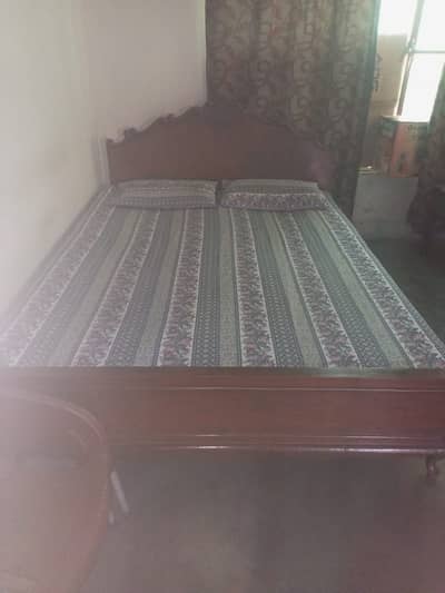 Double bed with mattress.