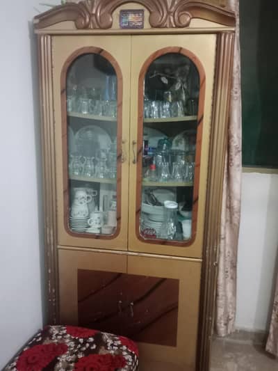 wooden crockery cabinet with glass door