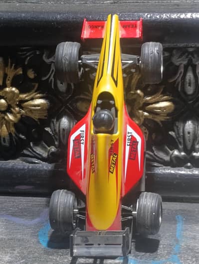 formula F1 car made by stainless steel with rubber tire