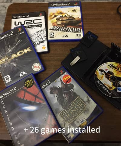 PlayStation 2 slim with 32 games