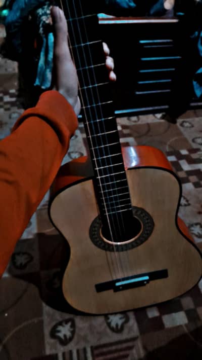 10/10 guitar with kapo and bag 40 inches