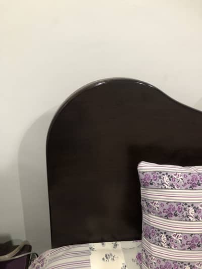 Bed with bedside table