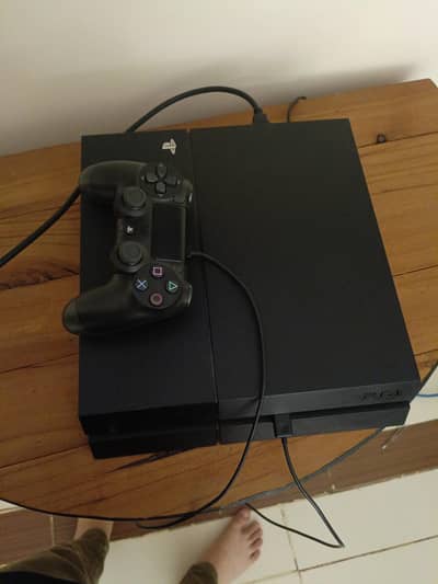 ps4 with controller  and a game