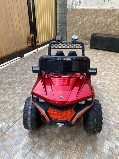 Red chargeable and remote control jeep