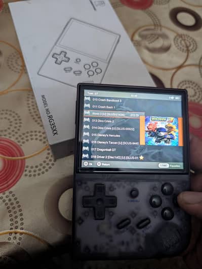 Anbernic RG35XX for sale. Almost New with Box, card and cable