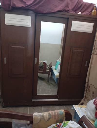 three door sliding wooden door cupboard new in condition