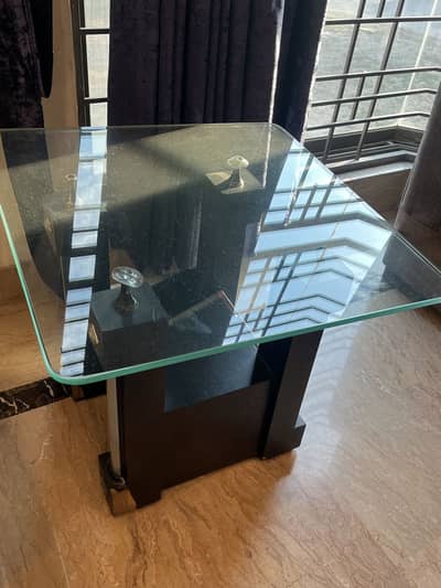 one centre table with two side table