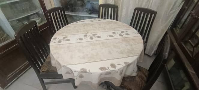 5 chairs with glass dinner table