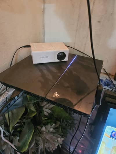 ps4 with one controller and steering wheel whith padels