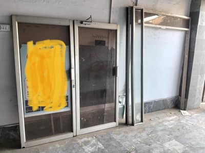 Aluminium Glass door of clinic with oxygen cylinder steel chairs 8