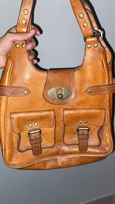 Uk brand: Mulberry Roxanne or a similar early-2000s design .