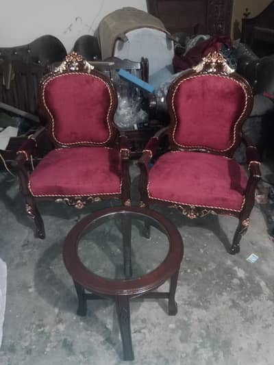 wooden arm chairs with round glass top table