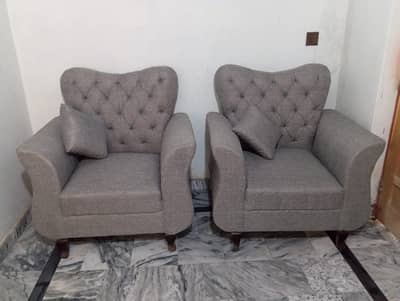 2 single seater sofas