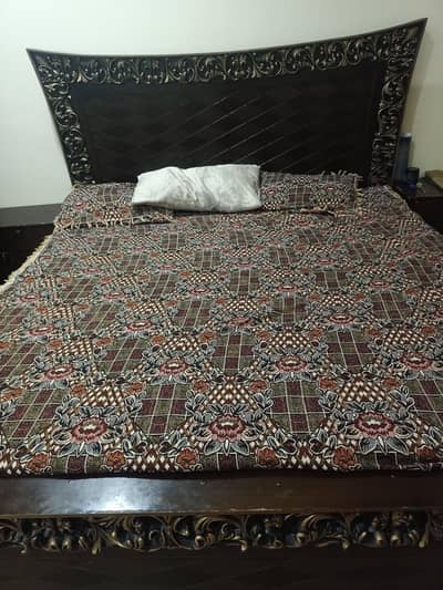 Wooden bed with two side tables