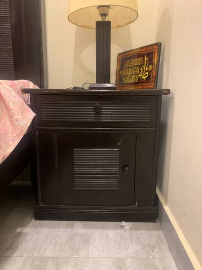 Wooden bed with side tables and mattress