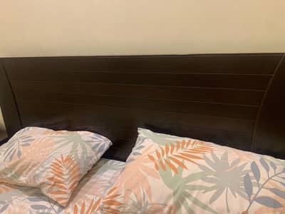 Bed with side tables and spring mattress
