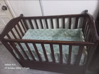 baby cot wooden with molty foam thin mattress.