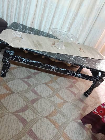 Wooden table and rapped with marble sheet