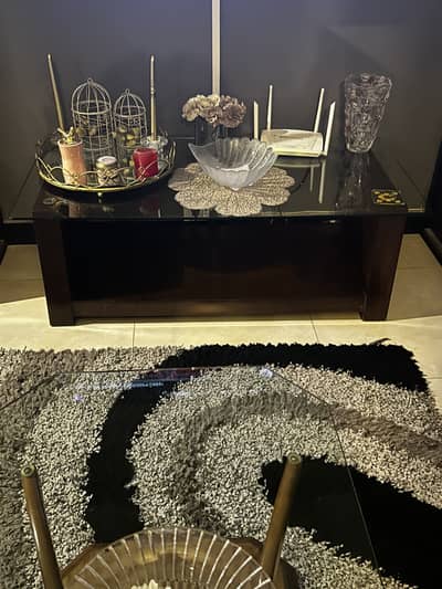 Wooden coffe table with glass on top