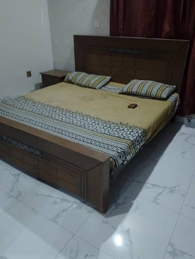 double bed with mattress and 1 side table