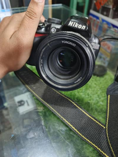 Nikon d3100 with 50mm sharpness lens with 2 battery 1 charger with bag