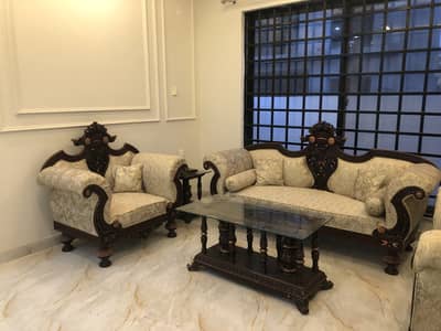 Six seater sofa set with side and center tables and a show case
