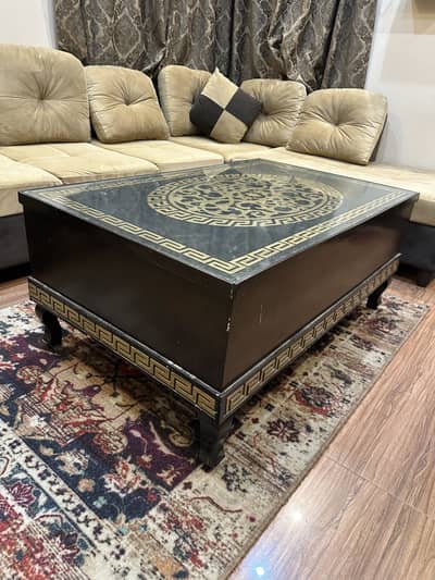 Wooden table with glass top