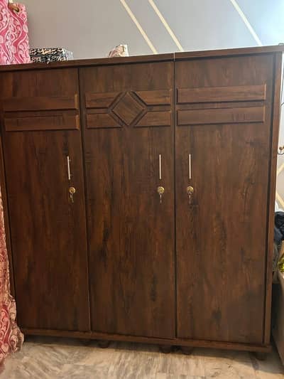 3 door wood cupboard