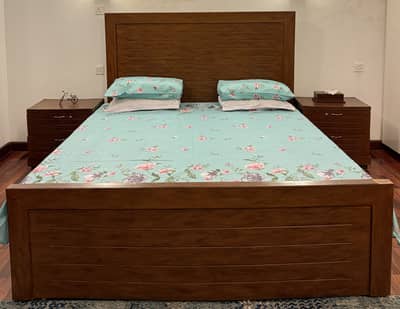 bed with side tables but without mattress