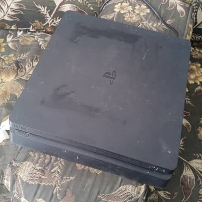 ps4 slim 500gb with one controller and 4 games