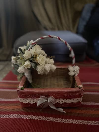 Decorative basket with artificial flowers