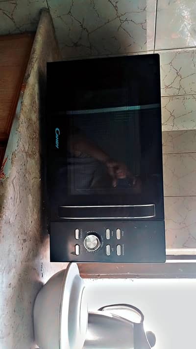 Almost New: Haier Candy 25L Microwave Oven