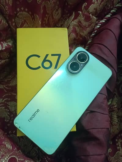 Realme C67 10 by 9 one hand use