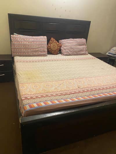 Wooden bed with side table for sale
