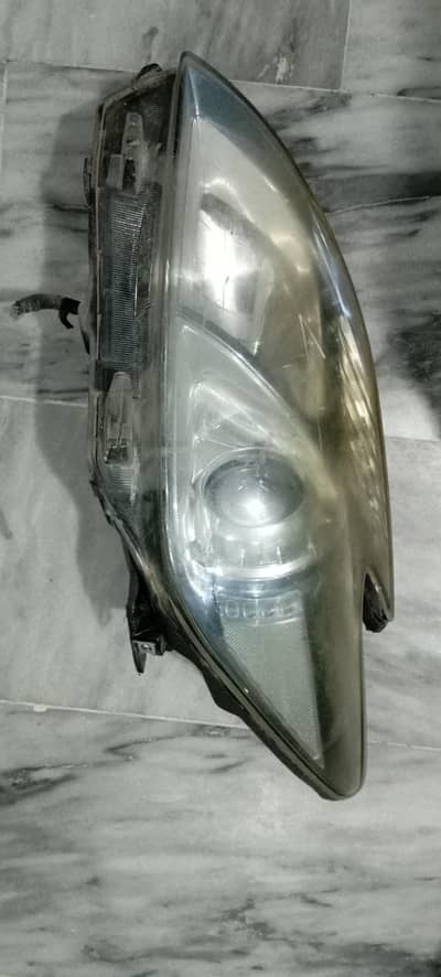 Prius 2009-2015 left side headlight orignal one used on not used local