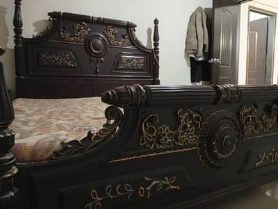 wooden bed and dressing table