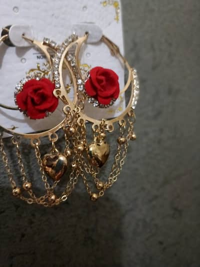 Elegant red rose gold hoop earrings with heart charms and chains