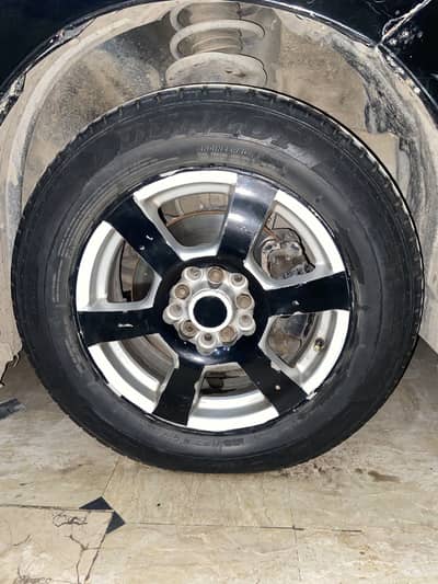 Tyre 15 6 shade rim  black colour ka paper laga hai